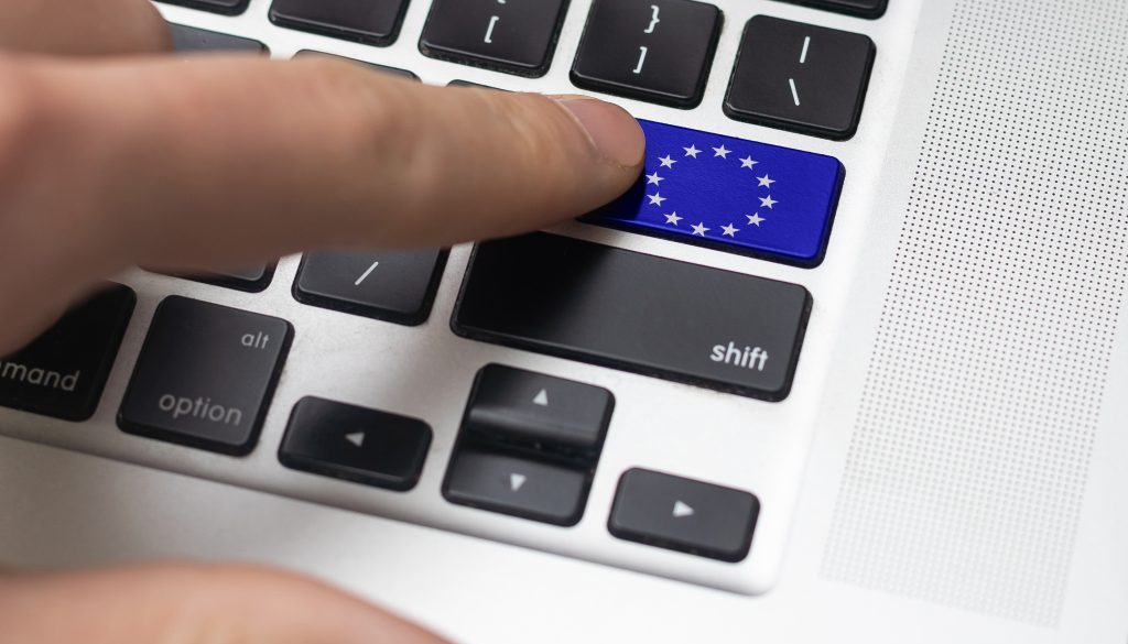 European Union and EU community CE marking concept with sign, symbol and EU flag on a computer key