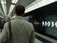 man waiting for a train in the subway