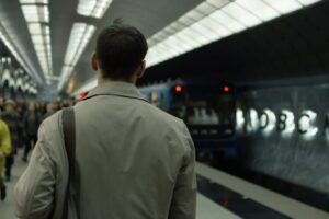 man waiting for a train in the subway